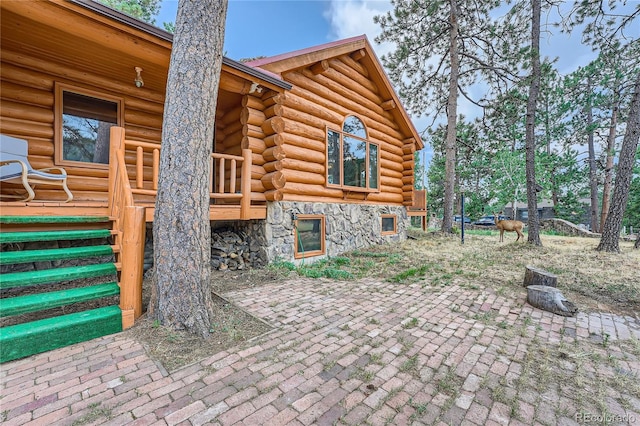 view of side of property featuring a patio