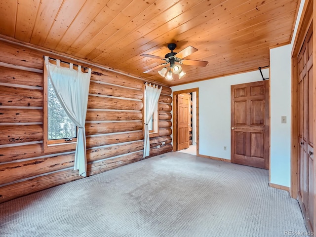 unfurnished bedroom featuring ceiling fan, carpet, wood ceiling, and a closet