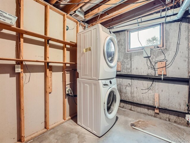 laundry room with stacked washer and clothes dryer