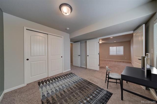 home office with light carpet and a textured ceiling