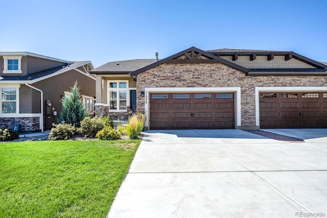 view of front of home featuring a garage and a front lawn