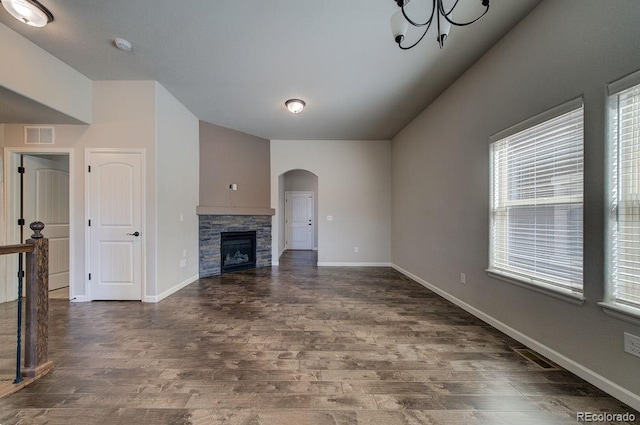 unfurnished living room with a fireplace and dark hardwood / wood-style floors