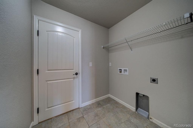 laundry room featuring hookup for a washing machine, electric dryer hookup, and a textured ceiling