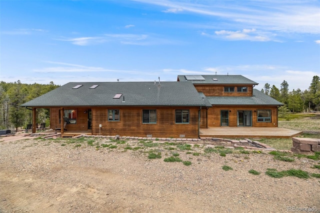 1002 County Road 99, Black Hawk, CO 80422 - back of property featuring covered porch and solar panels