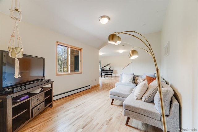 1002 County Road 99, Black Hawk, CO 80422 - living area featuring baseboard heating, light wood-style flooring, and arched walkways