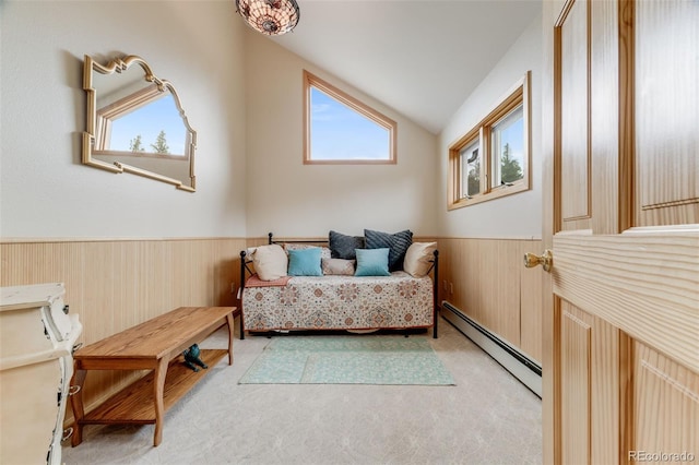 1002 County Road 99, Black Hawk, CO 80422 - bedroom with baseboard heating, vaulted ceiling, wainscoting, light colored carpet, and wooden walls