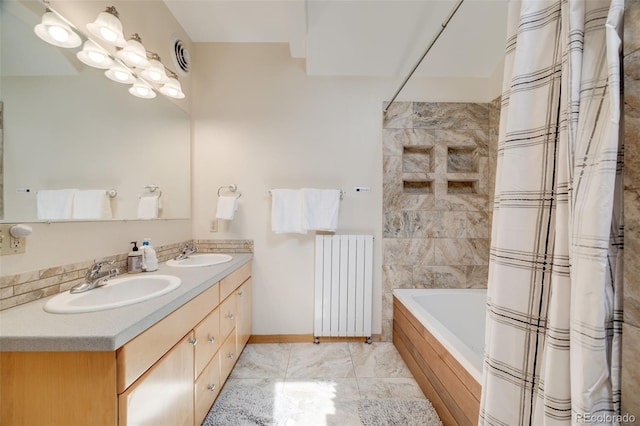 1002 County Road 99, Black Hawk, CO 80422 - bathroom with radiator heating unit, shower / bathtub combination with curtain, double vanity, marble look tiles, and baseboards