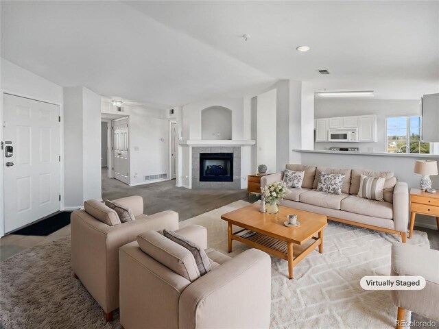 6850 Xavier Cir Unit 12, Westminster, CO 80030 - living area featuring lofted ceiling and a fireplace