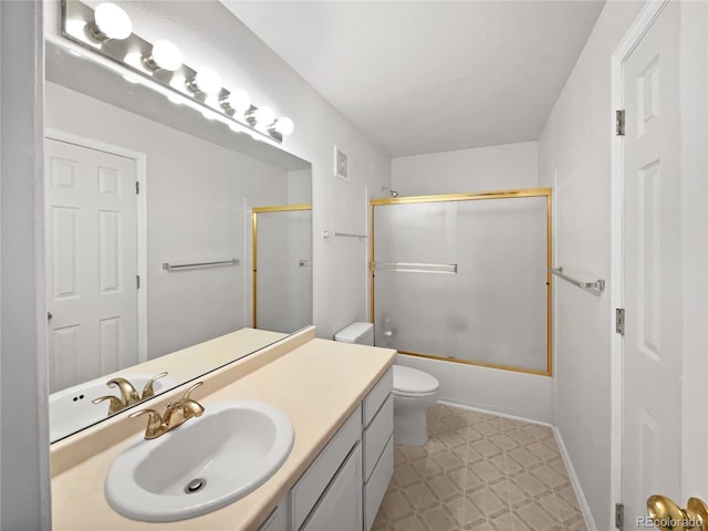 6850 Xavier Cir Unit 12, Westminster, CO 80030 - full bathroom featuring toilet, vanity, combined bath / shower with glass door, and tile patterned floors