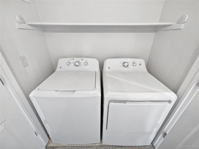 washroom featuring washer and dryer