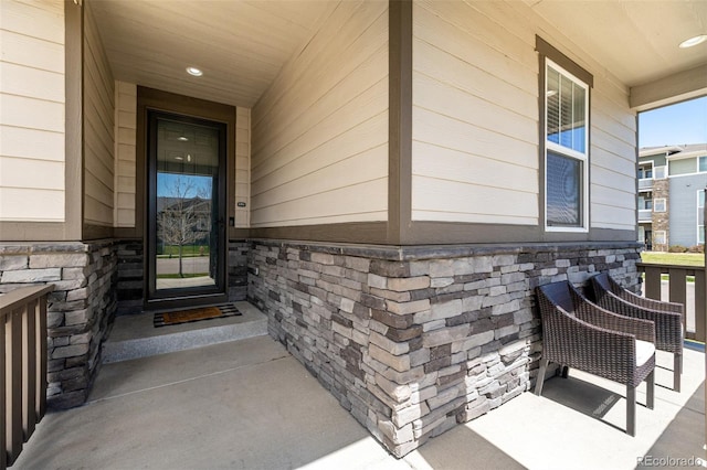 10595 Boston St, Commerce City, CO 80640 - view of exterior entry featuring stone siding and covered porch