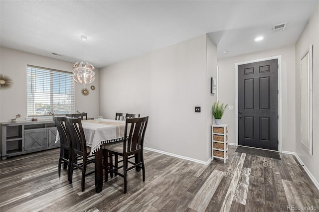 10595 Boston St, Commerce City, CO 80640 - dining area with dark wood-style floors, baseboards, a chandelier, and recessed lighting
