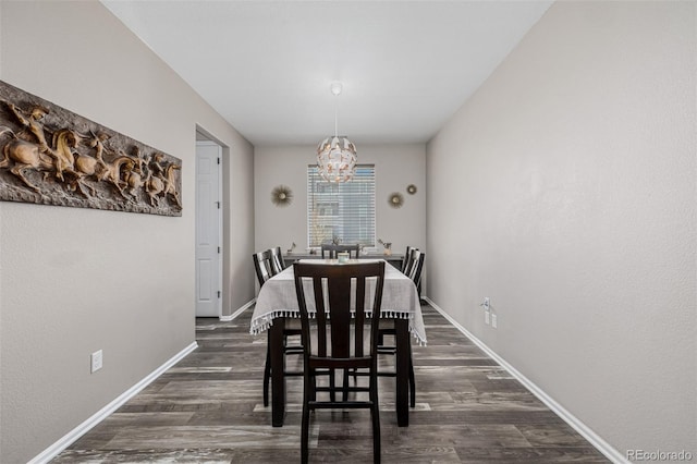 10595 Boston St, Commerce City, CO 80640 - dining area with dark wood-type flooring, a chandelier, and baseboards