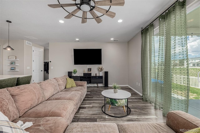 10595 Boston St, Commerce City, CO 80640 - living area featuring ceiling fan, recessed lighting, wood finished floors, and baseboards