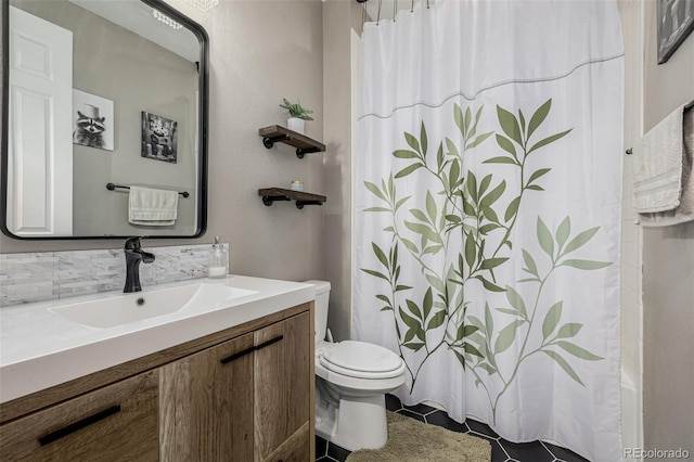 10595 Boston St, Commerce City, CO 80640 - full bath with toilet, vanity, and tile patterned flooring
