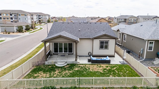 10595 Boston St, Commerce City, CO 80640 - rear view of house featuring a residential view, a patio, an outdoor hangout area, and a shingled roof