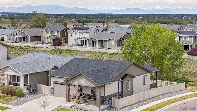 10595 Boston St, Commerce City, CO 80640 - aerial perspective of suburban area featuring a mountainous background
