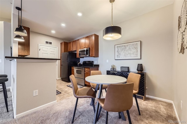 view of carpeted dining area