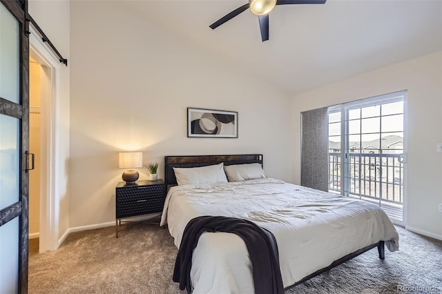 bedroom with a barn door, ceiling fan, carpet flooring, and access to exterior