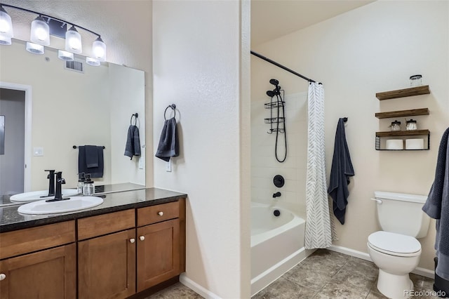 full bathroom featuring toilet, tile patterned flooring, vanity, and shower / tub combo with curtain