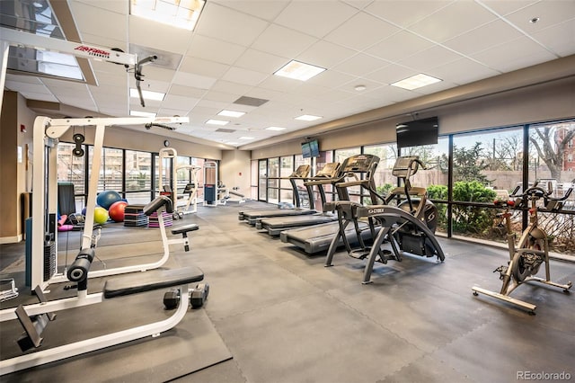 gym with a paneled ceiling