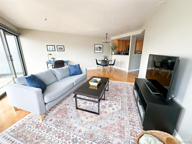 living room featuring plenty of natural light and light hardwood / wood-style flooring