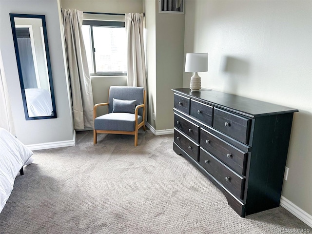 sitting room featuring light colored carpet