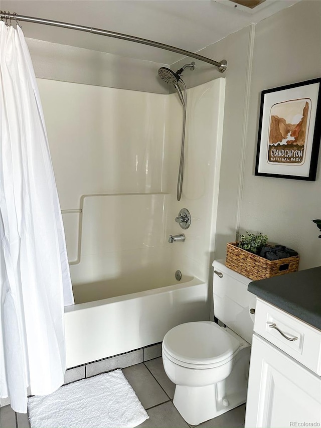 full bathroom with vanity, toilet, tile patterned floors, and shower / bath combo