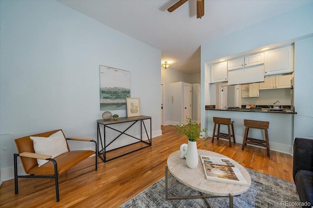 interior space with ceiling fan and light hardwood / wood-style floors