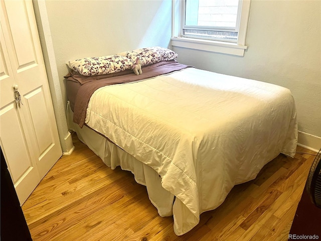 bedroom with light hardwood / wood-style floors