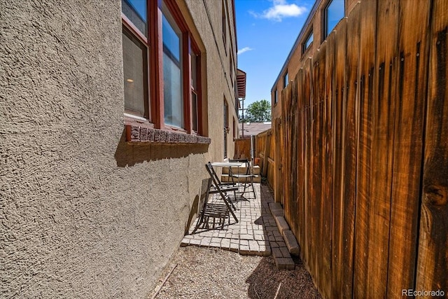 view of property exterior featuring a patio area