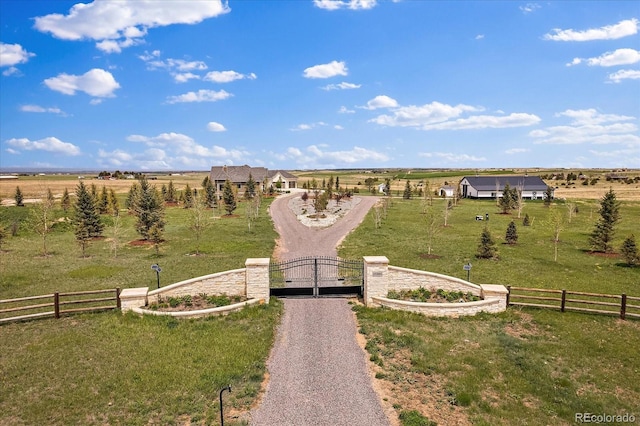 view of home's community with a yard and a rural view