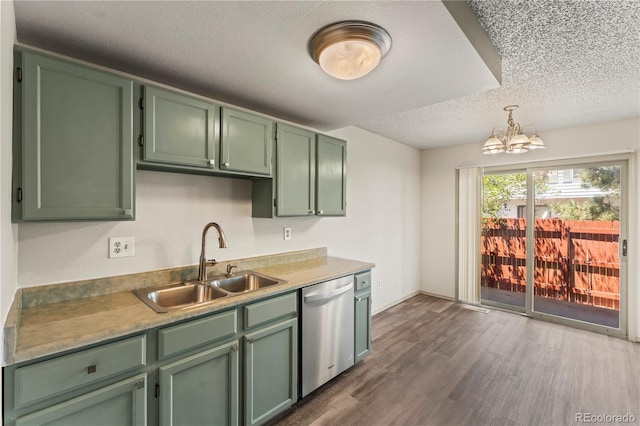 1344 Firefly Cir, Colorado Springs, CO 80916 - kitchen featuring dishwasher, a textured ceiling, a chandelier, green cabinets, and dark wood finished floors