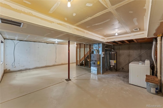 1344 Firefly Cir, Colorado Springs, CO 80916 - unfinished basement featuring gas water heater, heating unit, and stairway