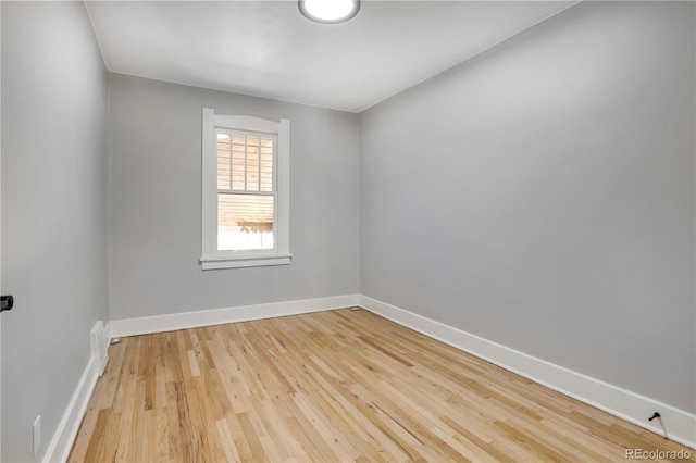 2103 S Lafayette St, Denver, CO 80210 - empty room with wood finished floors and baseboards