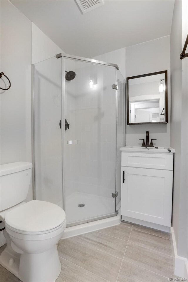 2103 S Lafayette St, Denver, CO 80210 - full bathroom featuring a stall shower and vanity
