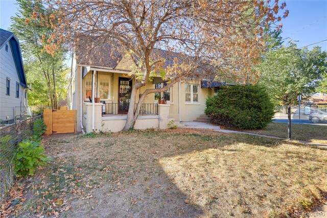 2103 S Lafayette St, Denver, CO 80210 - bungalow featuring stucco siding and covered porch