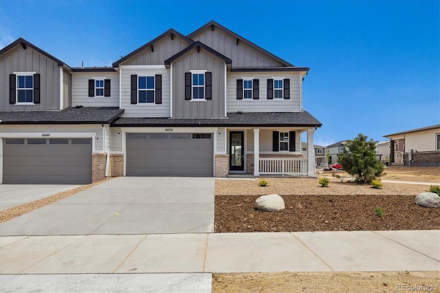 6636 N Nepal St, Aurora, CO 80019 - view of front of property featuring board and batten siding, covered porch, an attached garage, and brick siding