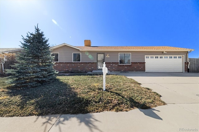 ranch-style home with a garage, brick siding, a chimney, and driveway