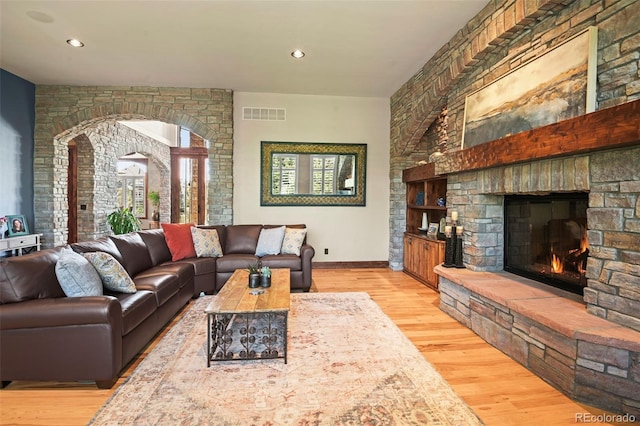 living room featuring a fireplace and light hardwood / wood-style floors