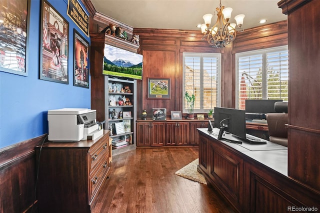 office space featuring dark wood-type flooring, an inviting chandelier, and wood walls