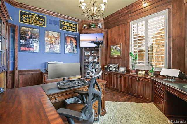 office space with ornamental molding, dark hardwood / wood-style floors, a notable chandelier, and wood walls