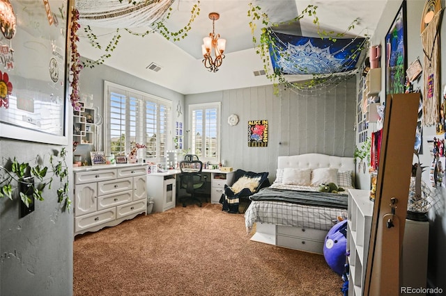 carpeted bedroom with a raised ceiling and a notable chandelier