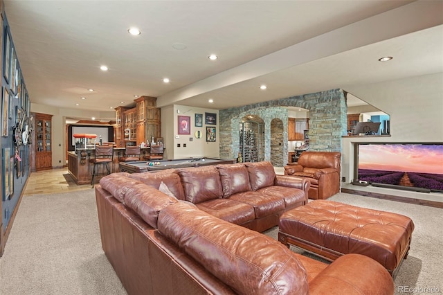 living room with light carpet, pool table, ornate columns, and indoor bar