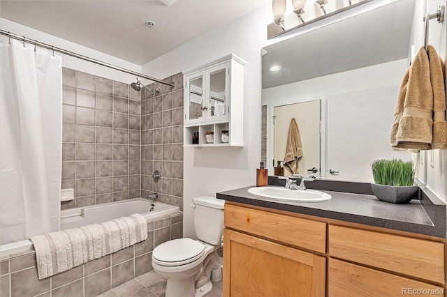 full bathroom with vanity, shower / tub combo, tile patterned floors, and toilet