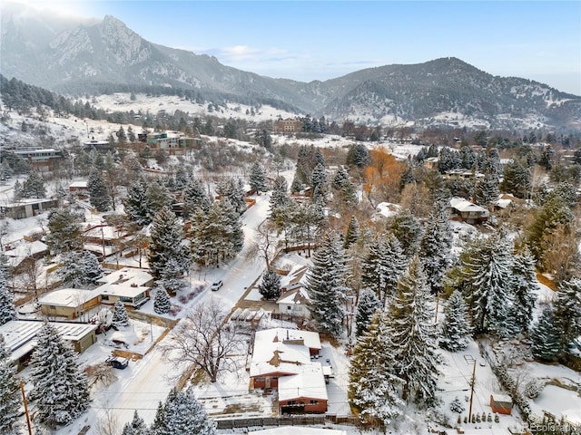 snowy aerial view with a mountain view