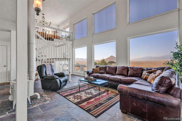 living room with a textured ceiling and a chandelier