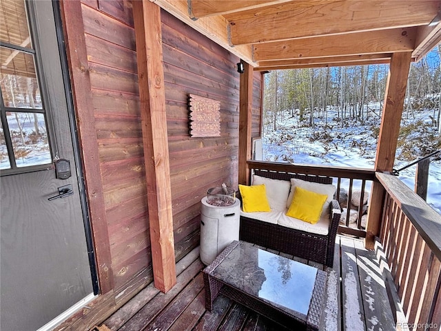 view of snow covered deck