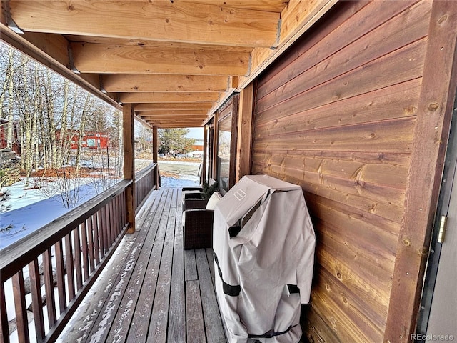 snow covered deck featuring grilling area