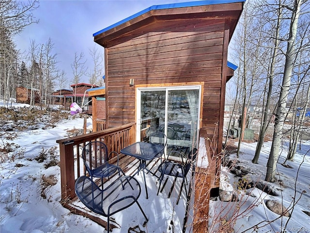 view of snow covered deck